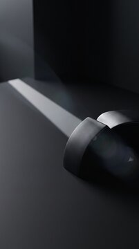 Creative dark-mode header visual: pristine black studio layout with a single diagonal shadow and asymmetrical object placement.