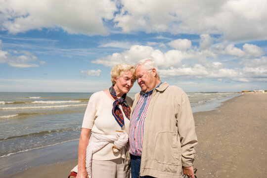 Cheerful Senior Couple Enjoys Time Together At The Sea