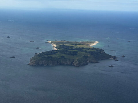 A breathtaking aerial view of the island of Herm, part of the Bailiwick of Guernsey in the Channel Islands. The image beautifully captures the island's unique geography