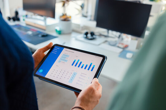 Tablet Displaying Analytics Dashboard in Office