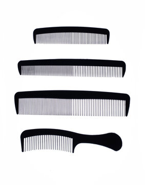A group of black combs on a white background.
