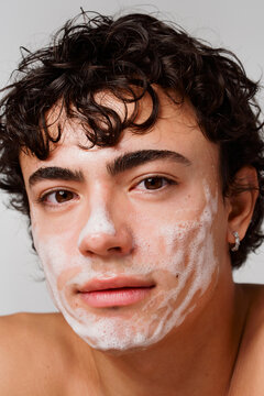 Young Man With Cleansing Foam on His Face During Skincare Routine