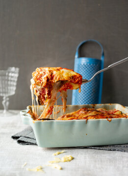 Delicious cheese stretching from a slice of Zucchini lasagna