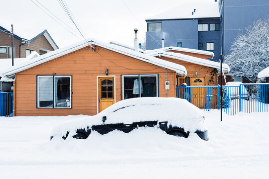Snow Buried Car by House