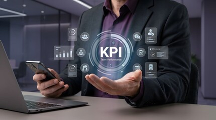 Fototapeta premium Man presenting key performance indicator data visualizations with a smartphone and laptop