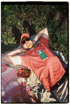 Man Relaxing on Blanket Outdoors 