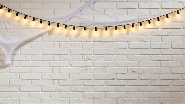 Halloween White Brick Wall with String Lights and Spiderweb