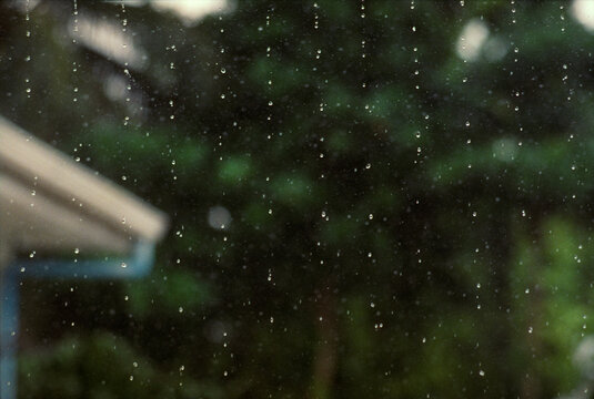 Tropical Rain Falling From Roof