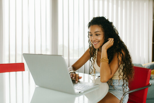 Woman Smiling Using Laptop Portrait