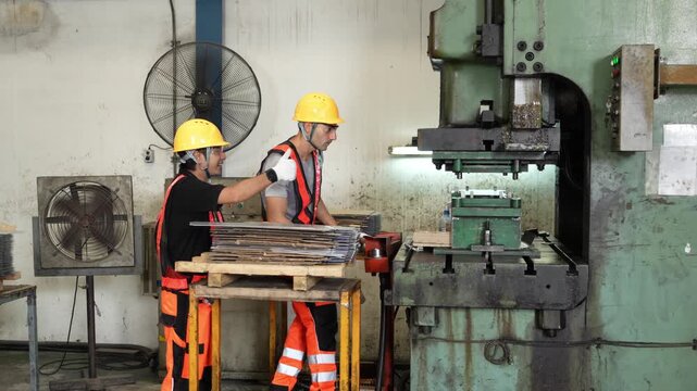 Finished sheet metal inspection sends the technicians into a conversation about the next stamping setup at the machine