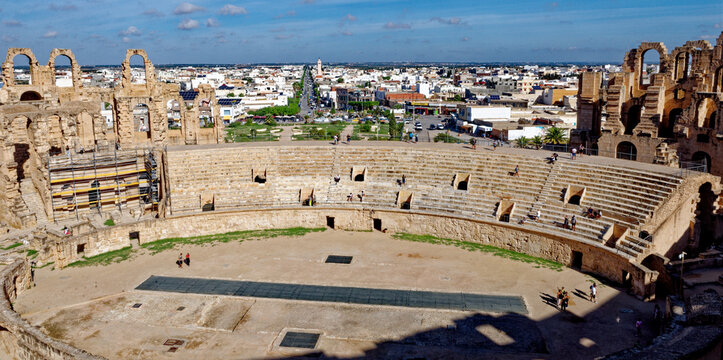 Overview of Ancient El Jem Amphitheatre Arena and Scaffolding with Sprawling Town Skyline