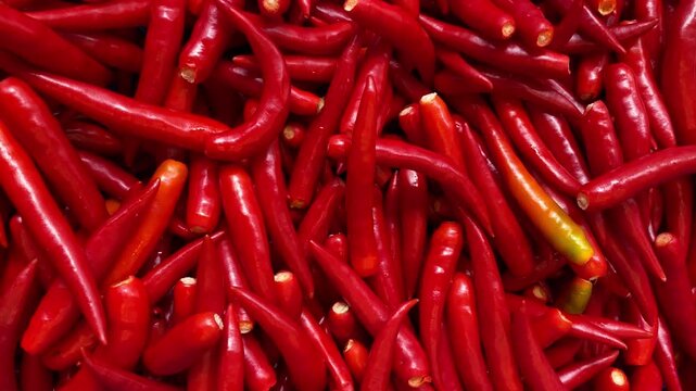 Pile of Fresh Red Chili Peppers Creating Vibrant Red Vegetable Background