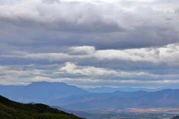 Fototapeta premium Mountain Range and Valley Under Overcast Sky