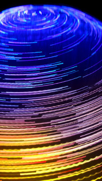 Futuristic Sphere of Light Trails and Neon Motion Lines Vertical Background