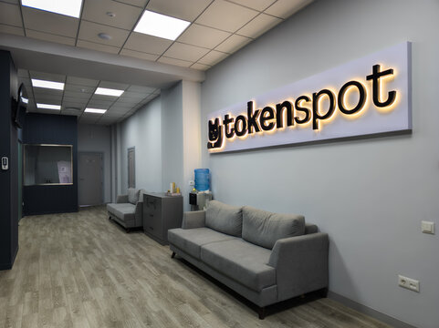 Modern Office Reception Area with "tokenspot" Sign