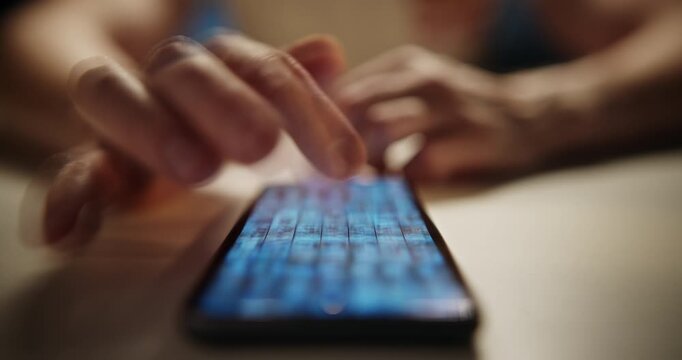 Doomscrolling. Close-up footage of a man's hand swiping through images on social media using a smartphone, featuring a creative multiple exposure effect and shallow depth of field. Modern digital life