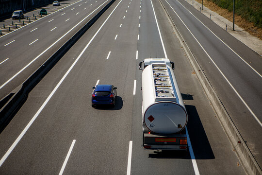 Two vehicles traveling on a highway during a clear day