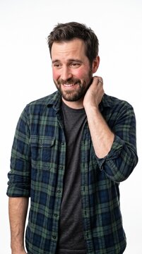 Man with flushed cheeks touches his neck, looking shy and embarrassed, white background