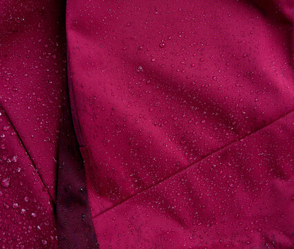 Waterproof fabric texture with rain drops closeup