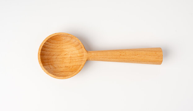 Empty wooden spoon, new light wood cooking ladle