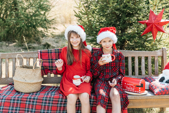 Christmas in July celebration with children outdoors in summer garden