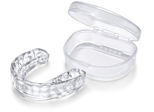 Clear dental night guard mouthguard with storage case isolated on white