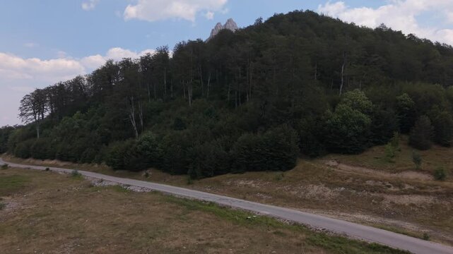 Aerial View of Forested Hillside and Road on Visocica Mountain Bosnia