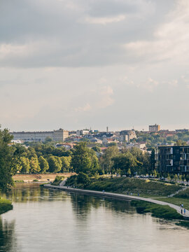 riverfront promenade with city skyline backdrop in Vilnius