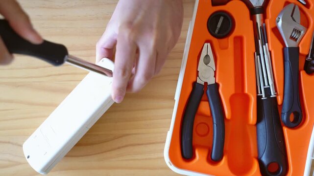 Hands cleaning metal frame glasses