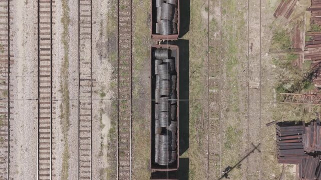 Aerial Top Down View of Freight Train Wagons Loaded With Rolled Steel Wire Coils in Podlugovi Station Bosnia