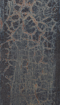 Dark painted metal surface with rust, scratches and weathered patina. Industrial abstract texture with organic lines and distressed details for backgrounds and design projects.