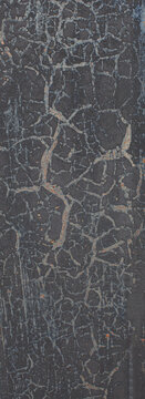 Dark black-painted metal texture covered with fine rust patterns, cracks and weathered details. Industrial distressed background with a rugged aged appearance.
