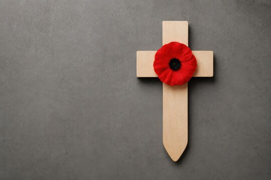 Honoring the fallen a remembrance day tribute with a poignant poppy placed upon a simple wooden cross