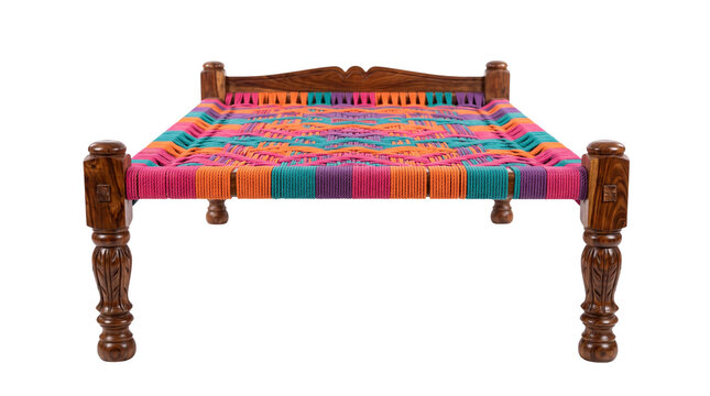 Traditional Indian charpai bed with colorful woven rope, handcrafted wooden daybed with vibrant patterns, rustic ethnic furniture isolated PNG with Transparent Background