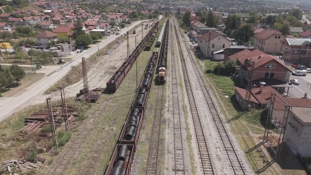 Aerial View of Railway Station and Freight Cargo Train Wagons Loaded with Rolled Steel Coils in Podlugovi Bosnia