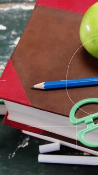 Animation of mathematical formulae over apple, school items and books