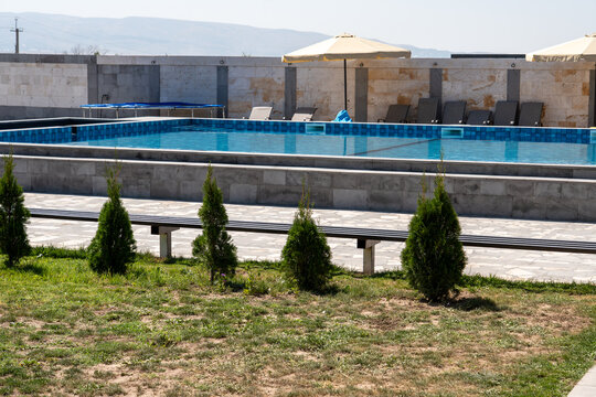 Outdoor Swimming Pool with Lounge Chairs.