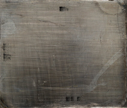 Distressed vintage daguerreotype metal photo plate background, texture with heavy scratches and dirt.