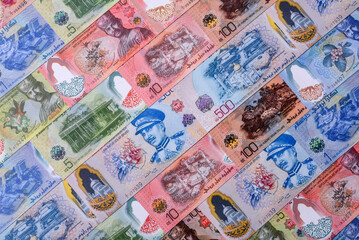 Brunei paper money, dollar banknotes and sen coins as currency for exchange or travel. Brunei money © chernikovatv