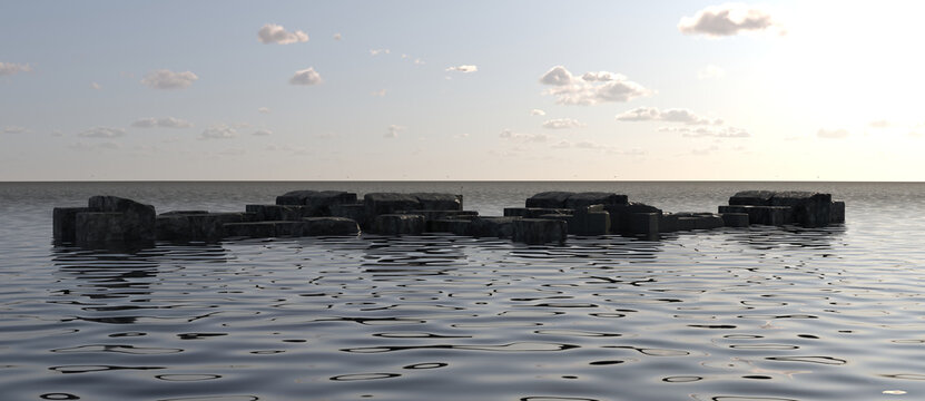 Low-lying ancient stone ruins partially submerged in the ocean at sunset