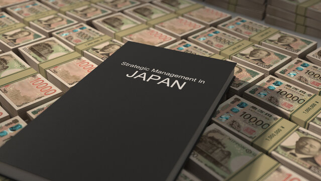 Strategic management in Japan book on top of Japanese yen bill bundles