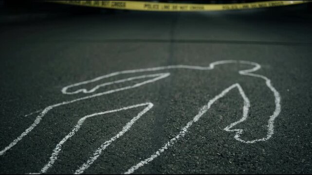 Chalk Outline of a Human Body on Dark Asphalt with Police Line Tape in Motion Symbolizing a Crime Scene Investigation or Forensic Evidence