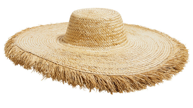 Isolated natural straw hat with wide floppy brim and stylish frayed edge, summer beach accessory
