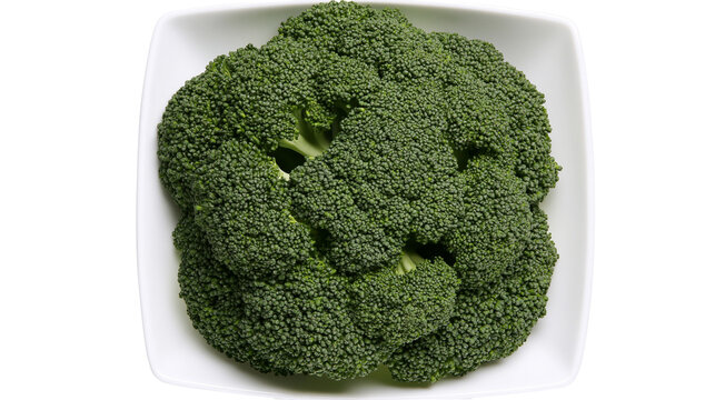 Isolated fresh green broccoli head in white bowl on simple backdrop for healthy eating