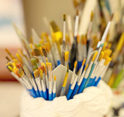 Set of paintbrushes in artist studio background © Zsolt Biczó