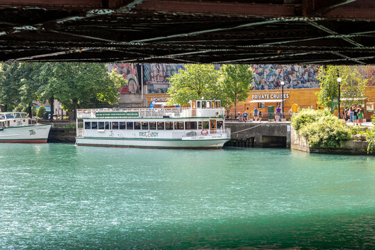 A tour boat docks along the Chicago Riverwalk, where visitors can only access it with numerous stairs,  amid a citywide lawsuit over ADA compliance, Chicago, Illinois, July