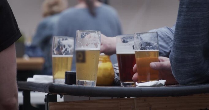 Beer table with drinkers and smoking people in Berlin