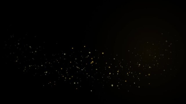 Golden dust particles floating on black background, motion overlay for luxury