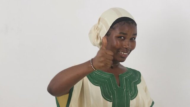 Confident young African woman giving two thumbs up in approval