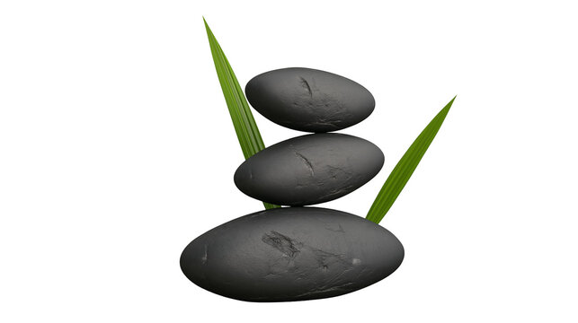 Isolated stack of three smooth black zen stones with green leaves for balance and tranquility